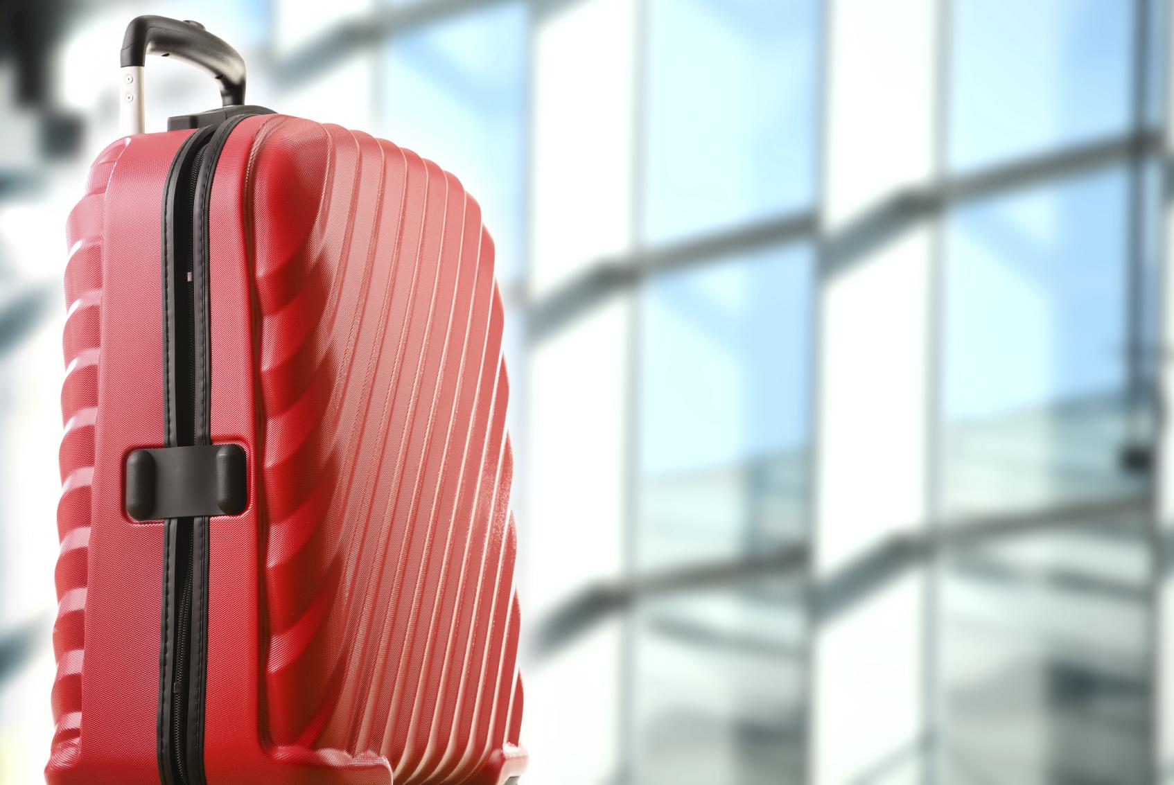 A Red Suitcase at the Airport (Photo: iStock)