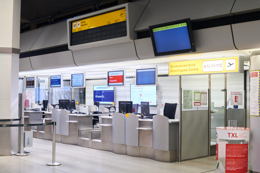 Check-in counters, once bustling with flyers, now sit quiet and abandoned at TXL. Photo courtesy: angeloedades on the FlyerTalk forums.